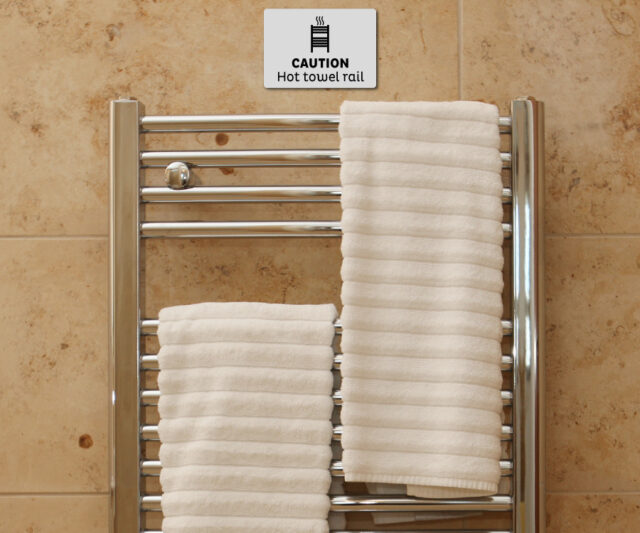 en056 en057 caution hot towel rail notice